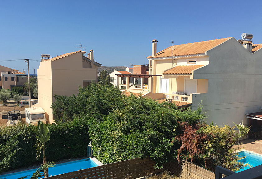 What should I pay attention to when buying real estate in Greece?